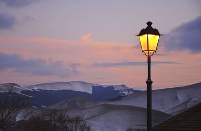 Street light against sky during sunset