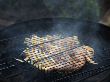 High angle view of meat on barbecue grill