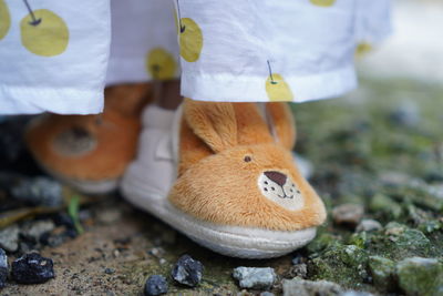 Cute babies standing on floor.