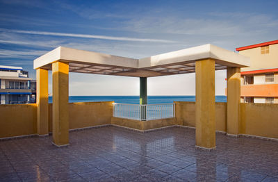 Built structure on beach against sky