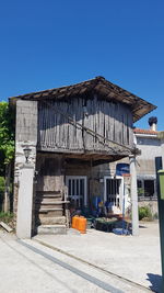 Exterior of old building against clear blue sky