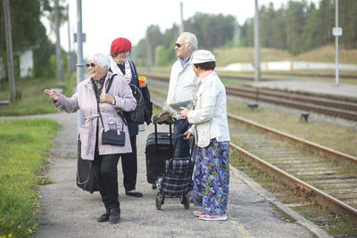 People standing on railroad track