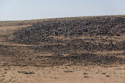 Scenic view of desert against clear sky