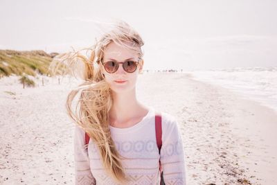 Portrait of woman standing on beach