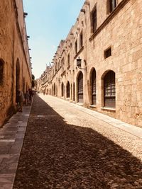 Alley amidst buildings in city