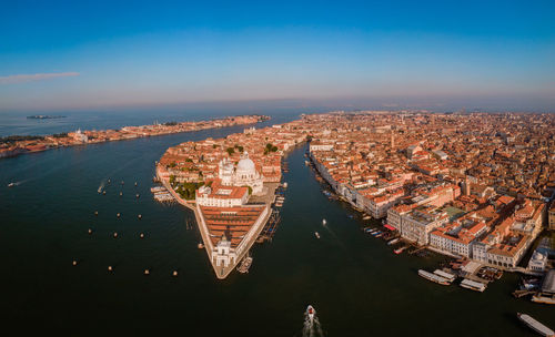 High angle view of river amidst buildings in city