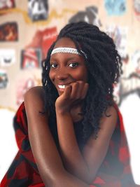 Portrait of a smiling young woman with dreadlocks