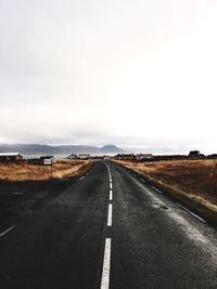 Empty road along landscape