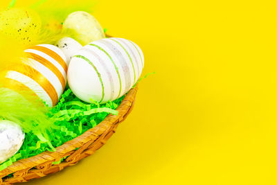 High angle view of food in basket against yellow background