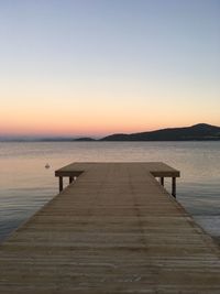 Pier over sea against clear sky