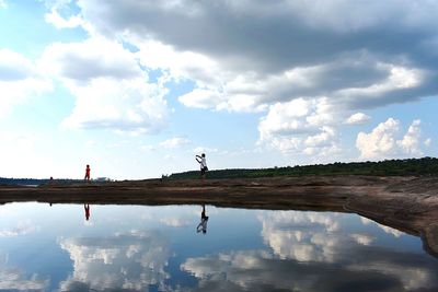 Reflection of clouds in lake against sky