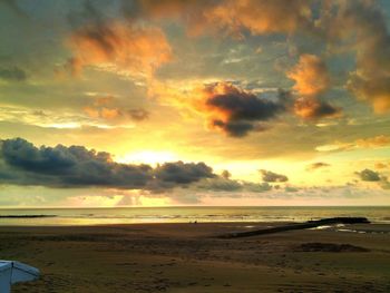 Scenic view of sea against cloudy sky