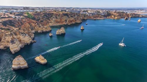 High angle view of sailboats in sea