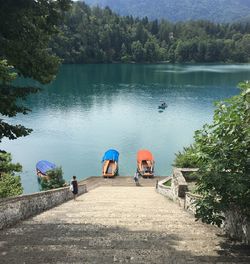 Steps leading towards pletna boats moored on lake bled