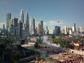 Modern buildings in city against sky