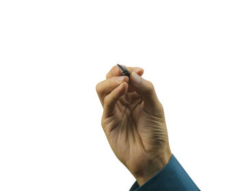 Close-up of woman hand against white background