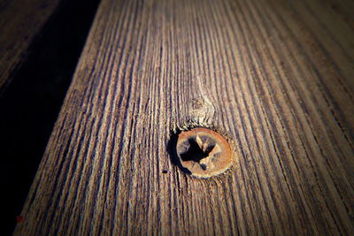 High angle view of old wooden plank on table