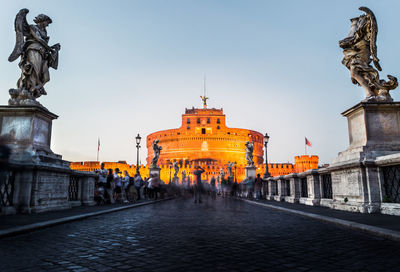 Statue of historic building against sky in city