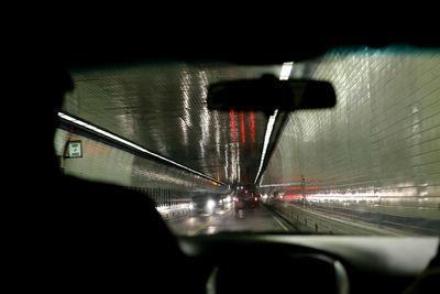 Close-up of cars moving in water