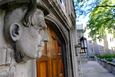 Low angle view of statue against building