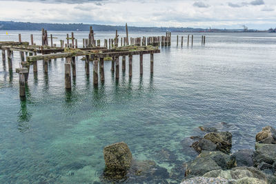 Pier on sea against sky