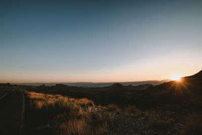Scenic view of landscape against sky during sunset