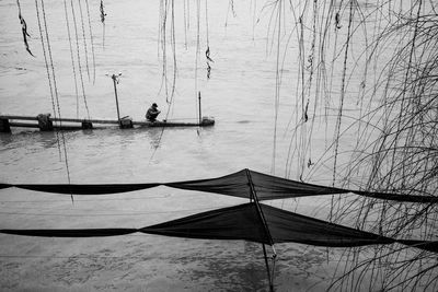 High angle view of men fishing in sea