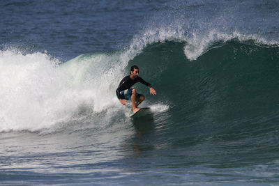 Man surfing in sea