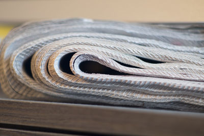 Close-up of stacked papers on table