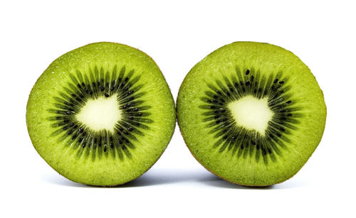 Close-up of fruit over white background