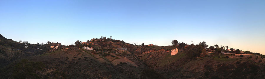 Panoramic view of hills against clear sky during sunset