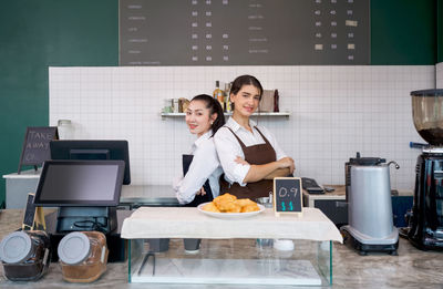 Portrait of chefs standing in kitchen