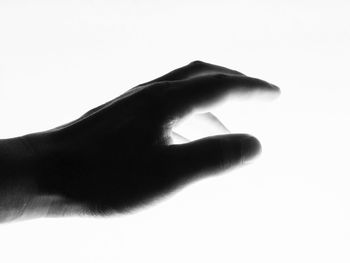 Close-up of human hand against white background