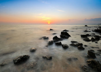 Scenic view of sea against sky during sunset