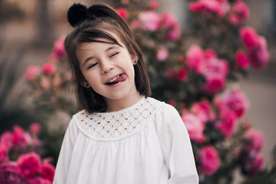 Funny kid girl 4-5 year old posing over nature background closeup. looking at camera. 