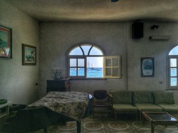 Empty chairs and table against wall at home