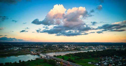 High angle view of bridge over river amidst buildings in city