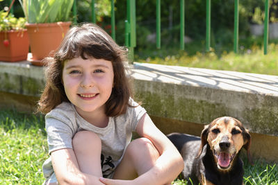 Portrait of smiling girl with dog