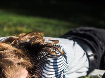 Woman lying on field