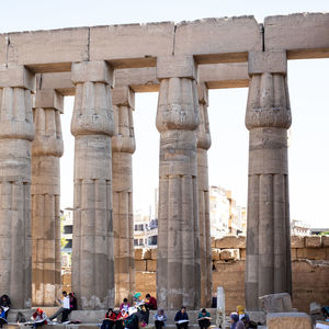 Stone pillars. luxor. tourists.