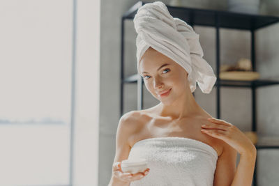 Portrait of woman in bathroom