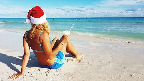 Woman sitting on beach