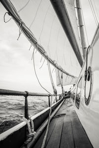 Cropped image of boat sailing on sea