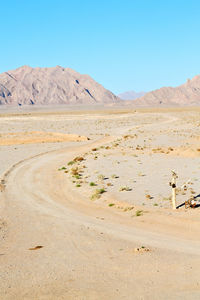 Scenic view of desert against clear sky