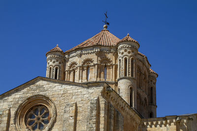 Low angle view of a building against clear blue sky