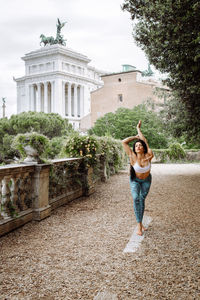 Woman standing in front of building