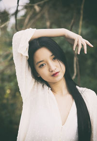 Chinese girl with plumeti blouse iii