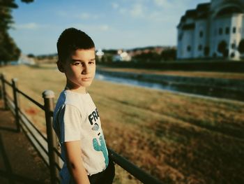 Portrait of boy standing outdoors