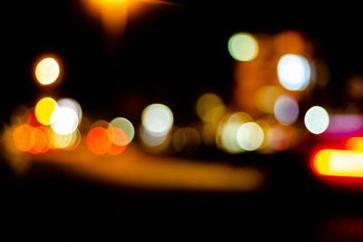 Defocused image of illuminated lights at night