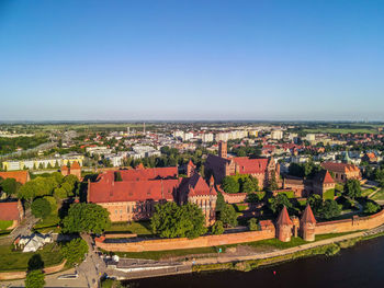High angle view of townscape against clear blue sky
